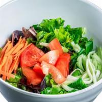 Green Salad · Mixed greens, carrots, cucumbers, tomatoes, and ginger dressing.