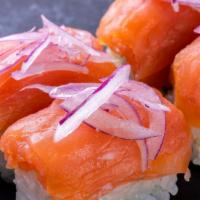 Philly Salmon Roll (4 Pcs) · California roll topped with cream cheese, salmon, and sliced onions with lemon and capers on...