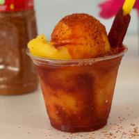 Mangonada · Blended combination of ice with Chamoy Chili Sauce and Tajin Salt, served with tamarind cand...