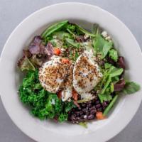 Americana Super Bowl · Two poached eggs, black beans, kale, quinoa, feta cheese, avocado, and mixed greens drizzled...
