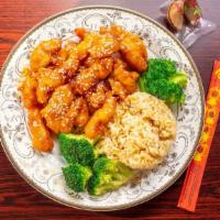 Sesame Chicken · Classic sweet and tangy sesame sauce and sesame seeds. served with fried rice and (1) egg ro...