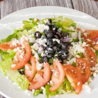 Green Salad · Romaine lettuce, fresh tomato, green pepper, black olives, red onions, and mozzarella cheese.