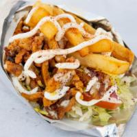 Paradise Pitarrito Sandwich · Mixed lamb and beef gyro, chicken, fries, and rice. Includes crispy lettuce, fresh tomatoes,...