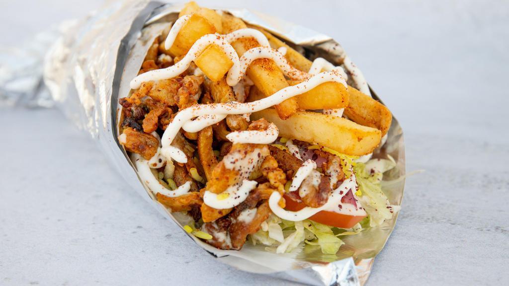 Paradise Pitarrito Sandwich · Mixed lamb and beef gyro, chicken, fries, and rice. Includes crispy lettuce, fresh tomatoes, onions, tahini sauce, and our signature garlic sauce.