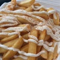 Garlic Fries · crispy French fries with a kick of Mediterranean zesty Garlic sauce