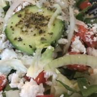 Greek Salad · Lettuce, tomato, cucumbers, onions, Greek olives, feta cheese, and dolmas. Served with oil a...