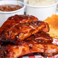 Baby Back Rib Plate · Half or full rack of baby back pork ribs, 2 sides and bread.