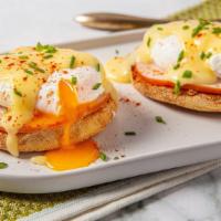 Eggs  Benedict  · toasted English muffin,  Canadian ham, poached eggs, and hollandaise sauce served with roast...