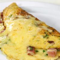 Ham And Cheese Omelette  · cheddar cheese, black forest ham, served with roasted potatoes.