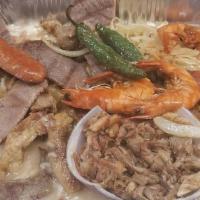 Molcajete Ranchero · Beef, chicken, shrimp, pork and cheese. No lleva arroz y ensalada.