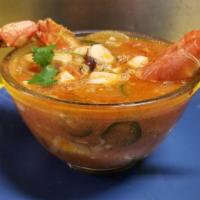 Sopa De Mariscos · Seafood Stew with Shrimp, octopus, fish, imitation crab,  mussels, prawns and crab legs.