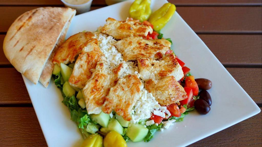Greek Chicken Salad · Greek salad topped with 8 oz. of chicken.