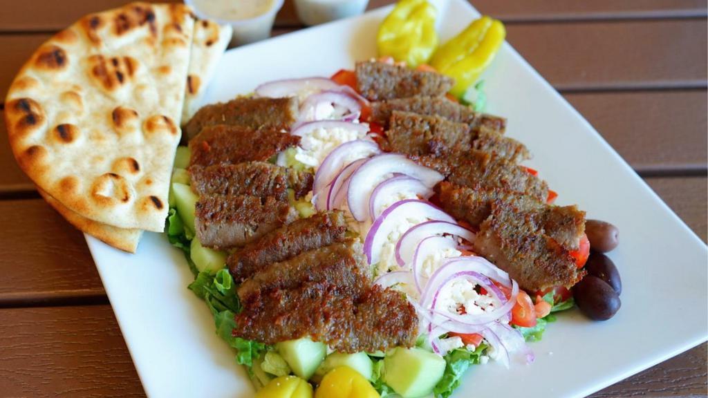 Greek Gyros Salad · Greek salad topped with 8 oz. of gyros.