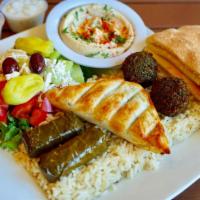 Veggie Combo · Best of all! Spinach pie, falafel, dolma, hummus, Greek salad, pita bread, and choice of ric...