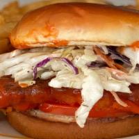 Spicy Chicken Sandwich · Breaded chicken breast glazed with buffalo sauce, topped with tomatoes, coleslaw and served ...
