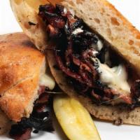 Pastrami Melt · Lean cut pastrami with melted mozzarella cheese on a ciabatta bread.