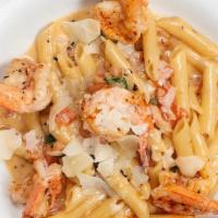 Jumbo Shrimp Penne Pasta · Sautéed jumbo shrimp, cajun spices, garlic, tomatoes, fresh basil & reduction cream sauce.