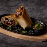 Asada Burrito · Carne asada burrito, crisped on the flat top with rice, beans, pico de gallo, and salsa.