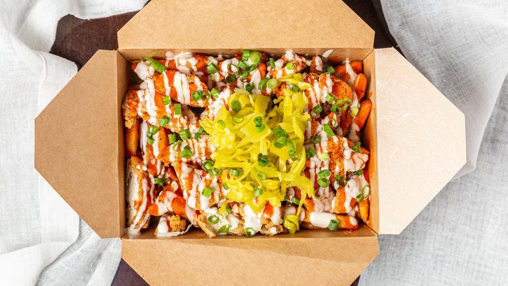 Chicken Loaded Fries · Breaded fried chicken fries with buffalo and ranch sauce topped with green onions and pepperoncini.