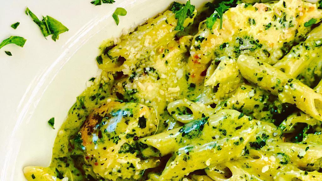 Chicken Penne Pesto · Chicken tenders and creamy pesto over penned past.