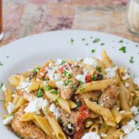 Chicken Penne Chipotle · Chicken tenders, sun-dried tomatoes, olive oil, olives, chipotle, fresh garlic, feta, over p...