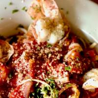 Tiger Shrimp Diablo · With onions, sherry wine, spicy marinara sauce, red pepper and roasted bell peppers over lin...