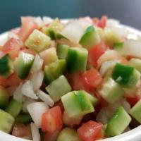 Shirazi Salad · What's good. Diced tomatoes, cucumbers, onions, lemon juice, salt and mint.