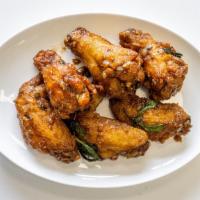 Thai-Basil Wings · Spicy. Fired chicken wings coated with Thai style basil sauce.
