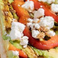 Avocado Toast. · Toasted artisan sourdough topped with fresh avocado, bell pepper, goat cheese and a balsamic...