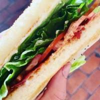 Blt. · Bacon, lettuce, and tomato on toasted sourdough bread