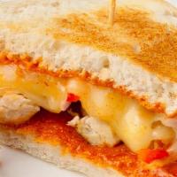 Hot Chicken Sandwich. · Grilled chicken breast, bell peppers and onions with melted provolone cheese and chipotle sa...