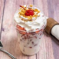 Fresas Con Crema · Strawberry with cream, with whipped cream and granola and a cherry on top.