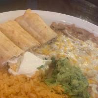 Chimiflautas · Chicken or beef rolled in a flour tortilla deep fried to perfection. Served with guacamole a...