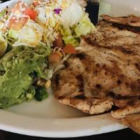 Pollo Asado · Grilled chicken breast Served with rice, refried beans, pico de gallo and guacamole.