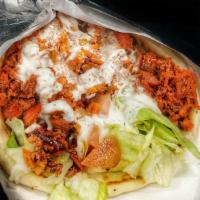 Chicken Gyro · Chopped marinated chicken, with lettuce and tomatoes topped with our special white sacue wra...