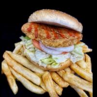 Crispy Chicken Sandwich With Fries · Crispy Chicken Sandwich with, lettuce, tomato, sliced onions, ketchup, and mayonnaise on a s...