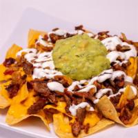 Nachos · With Cheese only or meat. Meat nachos come with guacamole, sour cream, cheese, and beans.