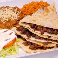 Quesadillas · Flour tortilla with melted cheese and choice of meat. Rice, beans, lettuce, tomato, and sour...