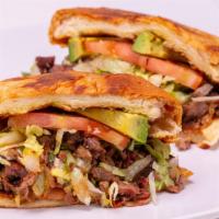 Tortas · Mexican sandwich served on a roll with mayonnaise, lettuce, beans, tomato, onion, cilantro, ...