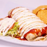 Wet Burrito · Rice, beans, and choice of meat topped with savory red sauce, sour cream, and cheese. With l...