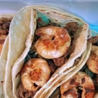 Surf & Turf Taco · Comes with asada and shrimp, cheese, guacamole, pico de gallo and chipotle cream.