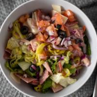 Antipasto Salad · Crisp green salad topped with Italian meats, red onions, cheeses,  tomatoes, olives, and pep...
