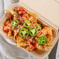 Spicy Poke Nachos · Your choice of tuna or salmon topped with edamame beans, jalapeños, habanero masago, dried n...