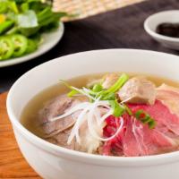 House Special Pho/ Phở Đặc Biệt · Rice noodle soup with rare steak, flank, brisket, tendon, tripe.