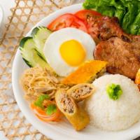 Deluxe Broken Rice/ Cơm Tấm Đặc Biệt · Porkchop, egg roll, shrimp, meatloaf, pork rinds, sunny egg./Sườn, chả giò, tôm nướng, chả t...