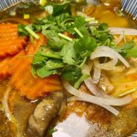 Vegan Lemongrass Noodle Soup · A rich flavorful lemongrass broth with thick rice noodle, vegan meats, fried tofu, bean curd...