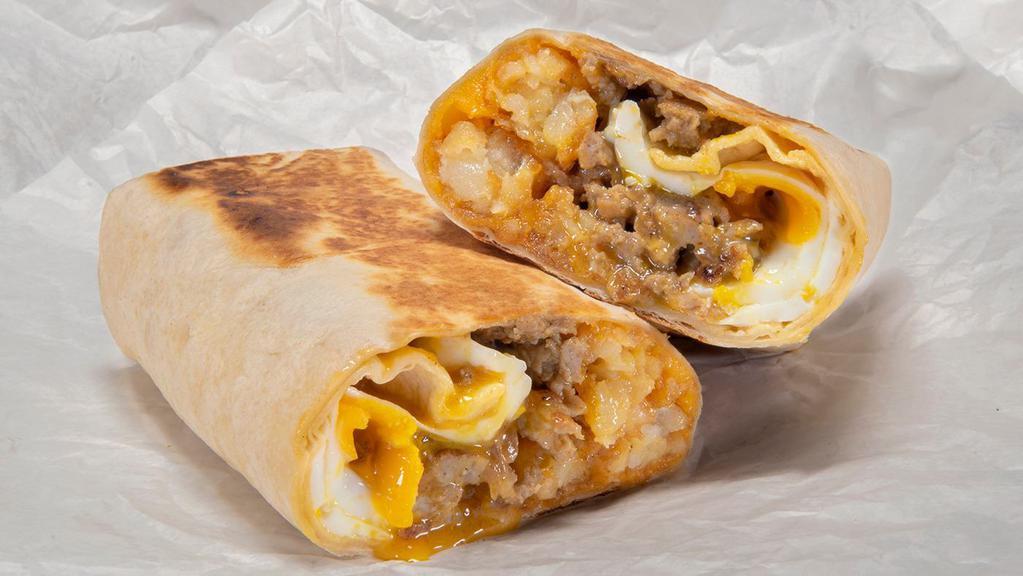 Worth The Hangover · 3 over easy Eggs, Crispy Tots, Polish sausage, Spicy Maple Mayo, Cheddar Cheese & Caramelized Onions; served in a Flour Tortilla.