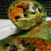 Mediterranean Hummus Wrap · Hummus, bell peppers, feta cheese, carrots, zucchini, onions, lettuce, olives and cucumbers