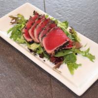 Seared Tuna Sashimi Salad · Five piece seared tuna served with our ginger ponzu sauce on a bed of green salad.