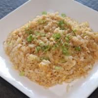 Plain Fried Rice · Pan-fried rice and egg topped with green onions and sesame seeds.
